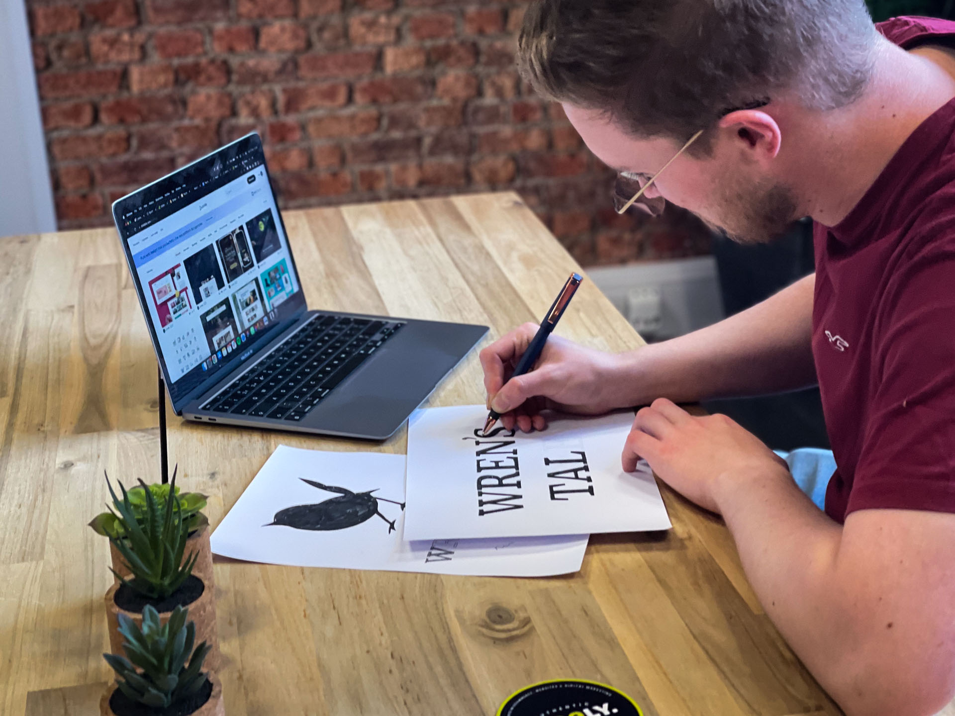 A Limely designer hand-lettering artwork in the studio
